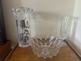a glass bowl and a glass vase on a table