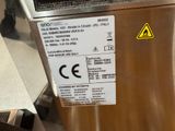 a picture of a stainless steel refrigerator with a sticker on it