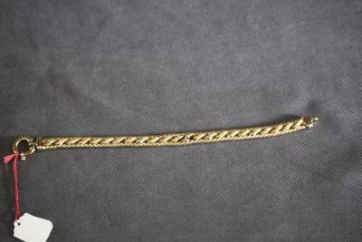 a close up of a gold chain with a tag on it