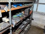 a lot of tools on the shelves in the garage