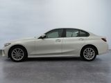 the bmw 3 series sedan is parked in a white room