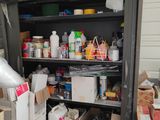 many boxes and containers on the shelves in the room