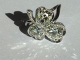 an image of a close up of a diamond flower broochle