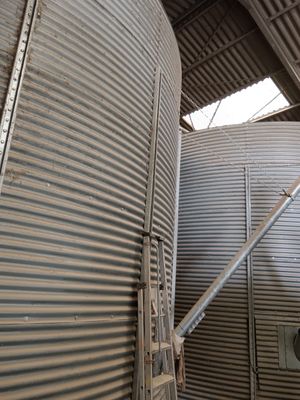 two large metal tanks that are next to each other