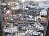 a metal cage filled with lots of assorted items