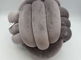 a stuffed animal that has a ring on it ' s finger