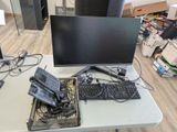 a desk with a keyboard, mouse, and monitor on it