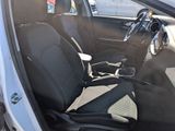 a picture of the inside of a car with black seats