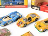a lot of toy cars that are sitting on a table