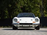 an image of a white sports car parked in a parking lot