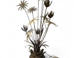 a lamp that has a bunch of flowers in it