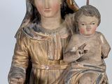 statue of a woman holding a baby in her arms