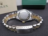 a rolex watch that is sitting on a table