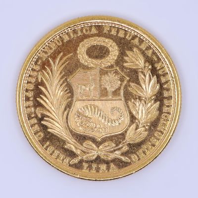 l'image d'une pièce d'or sur laquelle figurent des armoiries