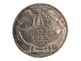 an old silver coin with a picture of a man and woman on it