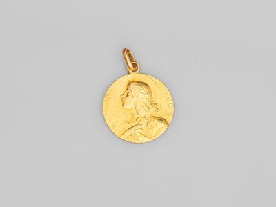 une pièce d'or portant le portrait d'un homme