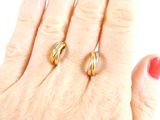 a woman ' s hand with two rings on it