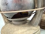 a large metal lantern that is sitting on a table