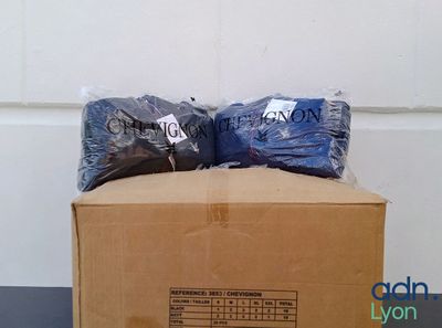 a box that has two bags on top of it