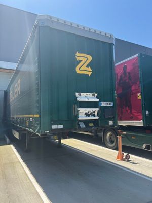 a semi truck that is parked in front of a building