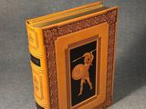 an old book with a picture of a man holding a sword