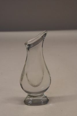 a glass vase that is sitting on a table