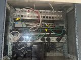 a computer cabinet with wires and wires in it