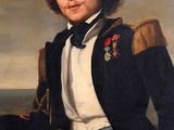 portrait of a man in a naval uniform sitting on a boat