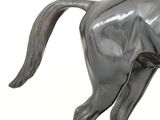 a statue of a horse that is standing on a base