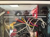 a glass case with a bunch of wires inside of it