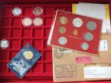 a red box with a lot of coins in it