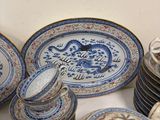 a lot of plates and cups on the table