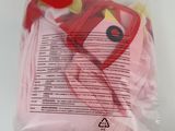 a plastic bag with a red and yellow object inside of it