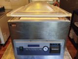 a machine that is sitting on a table in a kitchen