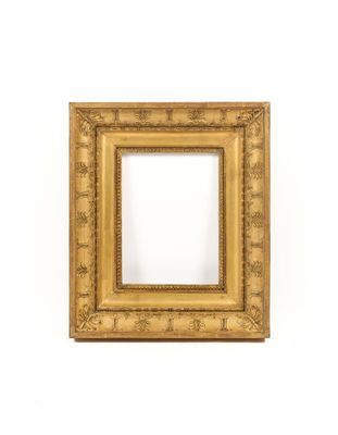 an antique gold frame with a decorative pattern on the edges