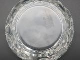 a glass plate with a design on it on a table