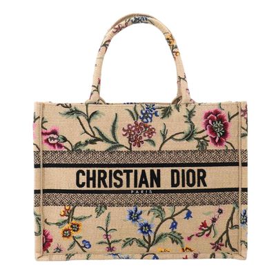 a close up of a bag with flowers on it