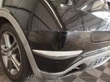 a close up of a car that has been painted black