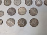a lot of coins that are on a table