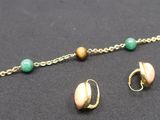 bracelet and earring set with multicolored beads on a black surface