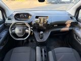 a dashboard of a small car with a steering wheel