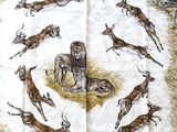 a picture of a table cloth with a lot of animals on it