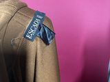 a close up of a brown jacket on a mannequin mannequin mannequin mannequin mannequin mannequin mannequin manne