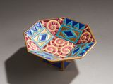 an image of a colorful bowl sitting on top of a table