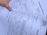 a person holding a piece of paper in their hand