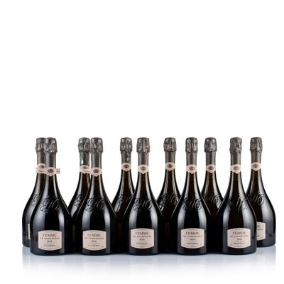 six bottles of champagne lined up in a row on a white surface