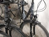 two bikes that are parked next to each other