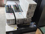 boxes of printer cartridges stacked on top of a pallet in a warehouse