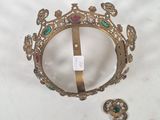 a picture of a gold crown on a white table