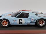a close up of a model of a blue and orange race car